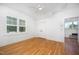 Bright bedroom with wooden floors and ceiling fan at 200 W Corbin St, Hillsborough, NC 27278
