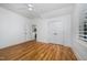 Bedroom featuring hardwood floors and a closet at 200 W Corbin St, Hillsborough, NC 27278