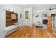 Welcoming entryway featuring hardwood floors, a coat rack, and a view into the living room at 200 W Corbin St, Hillsborough, NC 27278