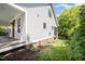 Exterior showcasing a view of the side of the home and the covered porch at 200 W Corbin St, Hillsborough, NC 27278