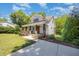 Beautiful property with a well-maintained lawn, covered front porch, and private driveway at 200 W Corbin St, Hillsborough, NC 27278