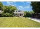 Charming home featuring a well-manicured front lawn and lush landscaping at 200 W Corbin St, Hillsborough, NC 27278