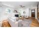 Bright living room featuring a fireplace, hardwood floors, and stylish decor at 200 W Corbin St, Hillsborough, NC 27278