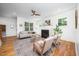 Inviting living room showcasing a fireplace, ample natural light, and comfortable seating at 200 W Corbin St, Hillsborough, NC 27278