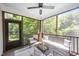 Relax on the screened porch with ceiling fan, perfect for enjoying the outdoors at 200 W Corbin St, Hillsborough, NC 27278