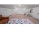 Spacious bedroom with high ceilings, play tent, and plush armchair for a cozy retreat at 2007 October Dr, Durham, NC 27703