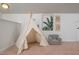 Cozy bedroom featuring a white play tent, plush chair, and botanical wall decor at 2007 October Dr, Durham, NC 27703