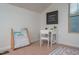 This bedroom area features a desk, chair, book storage and decor at 2007 October Dr, Durham, NC 27703