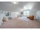 Large bonus room with carpet, teepee, and playroom furniture at 2007 October Dr, Durham, NC 27703