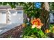 Landscaped flowerbed near a brick home with a two-car garage enhances curb appeal at 2007 October Dr, Durham, NC 27703