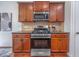 This traditional kitchen offers stainless steel appliances and sleek dark countertops and lovely wood cabinetry at 2007 October Dr, Durham, NC 27703
