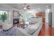 Bright and airy living room features a fireplace, modern furnishings, and hardwood floors at 2007 October Dr, Durham, NC 27703