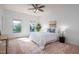 Bright main bedroom featuring two windows and ceiling fan at 2007 October Dr, Durham, NC 27703