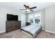 Cozy bedroom with a ceiling fan, window, dresser, and carpeted floors at 2008 Campana Dr, Raleigh, NC 27603