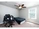 Comfortable bedroom featuring neutral decor, carpet floors, and large windows for natural light at 2008 Campana Dr, Raleigh, NC 27603