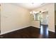 Cozy dining area with hardwood floors, decorative chandelier, and views of the outdoor landscape at 2008 Campana Dr, Raleigh, NC 27603