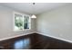 Bright, sunny space with beautiful hardwood floors, and a large window overlooking the yard at 2008 Campana Dr, Raleigh, NC 27603