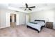 Spacious main bedroom offering carpet floors, a ceiling fan, and an ensuite bathroom at 2008 Campana Dr, Raleigh, NC 27603