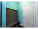 Functional mudroom with built-in bench seating, coat hooks, and storage cubbies for organization at 2008 Campana Dr, Raleigh, NC 27603