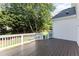 Back deck with white railing overlooking a lush green yard at 202 Chapel Valley Ln, Apex, NC 27502