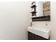 Modern bathroom with a vessel sink, dark wood vanity, and rustic wood accent wall at 202 Chapel Valley Ln, Apex, NC 27502