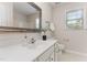Clean bathroom with white vanity, large mirror, and good natural light at 202 Chapel Valley Ln, Apex, NC 27502