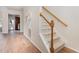 Inviting foyer boasts wood floors, a carpeted staircase, and an entryway into the kitchen at 202 Chapel Valley Ln, Apex, NC 27502