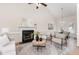 Open-concept living room featuring vaulted ceilings, fireplace, with easy access to dining area at 202 Chapel Valley Ln, Apex, NC 27502