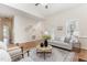 Bright living room with wood floors and vaulted ceilings flows seamlessly into the dining area at 202 Chapel Valley Ln, Apex, NC 27502