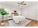 Comfortable main bedroom with ceiling fan, wood flooring, rug and great natural light at 202 Chapel Valley Ln, Apex, NC 27502