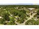 An aerial view of the property surrounded by lush trees, showing proximity to Raleigh at 202 Purvis St, Garner, NC 27529
