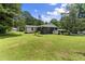 Spacious backyard with mature trees, offering a private outdoor retreat with ample room for recreation at 202 Purvis St, Garner, NC 27529