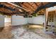 Spacious unfinished basement area with exposed ceiling rafters and concrete floors at 202 Purvis St, Garner, NC 27529