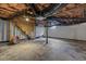 Unfinished basement with exposed ceiling and concrete floors at 202 Purvis St, Garner, NC 27529