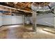 Unfinished basement with concrete floor, cinder block supports and exposed ceiling components at 202 Purvis St, Garner, NC 27529