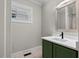 Bathroom featuring a modern vanity with a white countertop and a window for natural light at 202 Purvis St, Garner, NC 27529