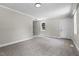 Spacious bedroom with neutral carpet, one window, and ample natural light at 202 Purvis St, Garner, NC 27529