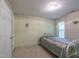 Cozy bedroom with a double bed, wallpaper border, neutral carpeting, and a closet at 2109 Star Sapphire Dr, Raleigh, NC 27610