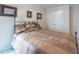 Cozy bedroom with a metal bed frame, decorative pillows, and soft, patterned bedding at 2109 Star Sapphire Dr, Raleigh, NC 27610