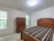 Comfortable bedroom featuring natural light, a wood bed frame, and a wardrobe at 2109 Star Sapphire Dr, Raleigh, NC 27610