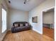 Versatile bonus room with a comfortable couch and an adjacent workspace, perfect for relaxation or productivity at 2109 Star Sapphire Dr, Raleigh, NC 27610