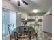 An eat-in kitchen features white cabinets, stove, sink, and a dining table at 2109 Star Sapphire Dr, Raleigh, NC 27610