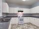 Functional kitchen with white cabinetry and modern appliances at 2109 Star Sapphire Dr, Raleigh, NC 27610