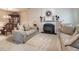 Elegant living room with plush sofas, a decorative fireplace, and sophisticated decor at 2109 Star Sapphire Dr, Raleigh, NC 27610