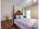Spacious bedroom with a four-poster bed, hardwood floors, and natural light at 2109 Star Sapphire Dr, Raleigh, NC 27610