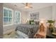 Bedroom featuring a colorful rug and bedding with a window and modern décor at 211 W Trinity Ave, Durham, NC 27701