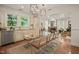 Bright dining area with modern lighting, seamlessly connects to the living room for entertaining at 211 W Trinity Ave, Durham, NC 27701
