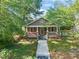 Beautiful craftsman home with inviting front porch and well-manicured lawn at 211 W Trinity Ave, Durham, NC 27701