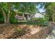 Charming home with a lush front yard and brick retaining wall at 211 W Trinity Ave, Durham, NC 27701
