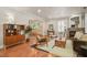 Stylish living room featuring hardwood floors, fireplace, and lots of comfortable seating at 211 W Trinity Ave, Durham, NC 27701